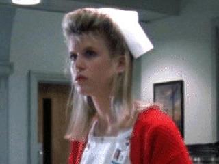 The red cardigan really adds some 'zazz to the traditional nurse look.